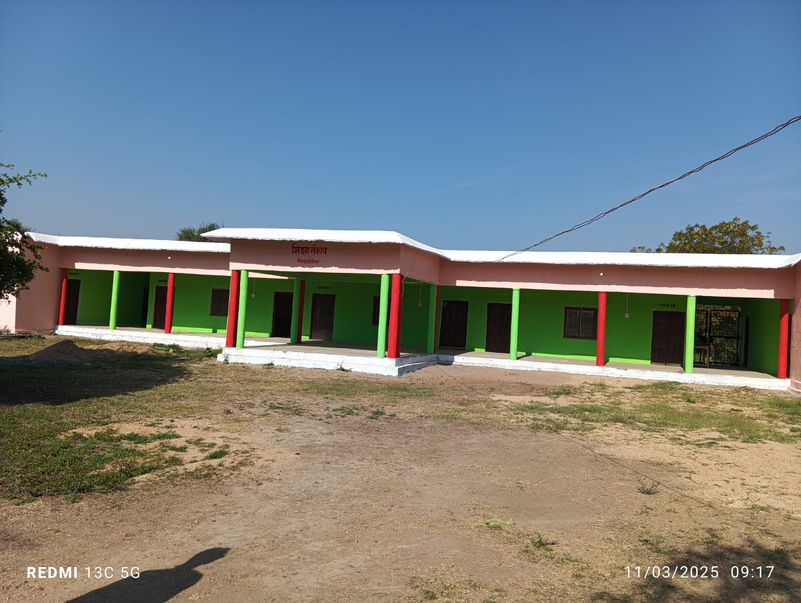 The Gurukul Academy classroom block with its freshly painted verandah