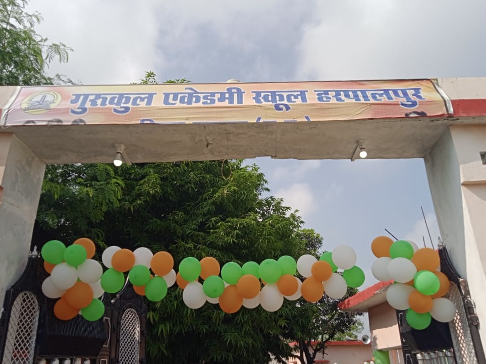 School gate decorated with tricolour balloons for a national celebration