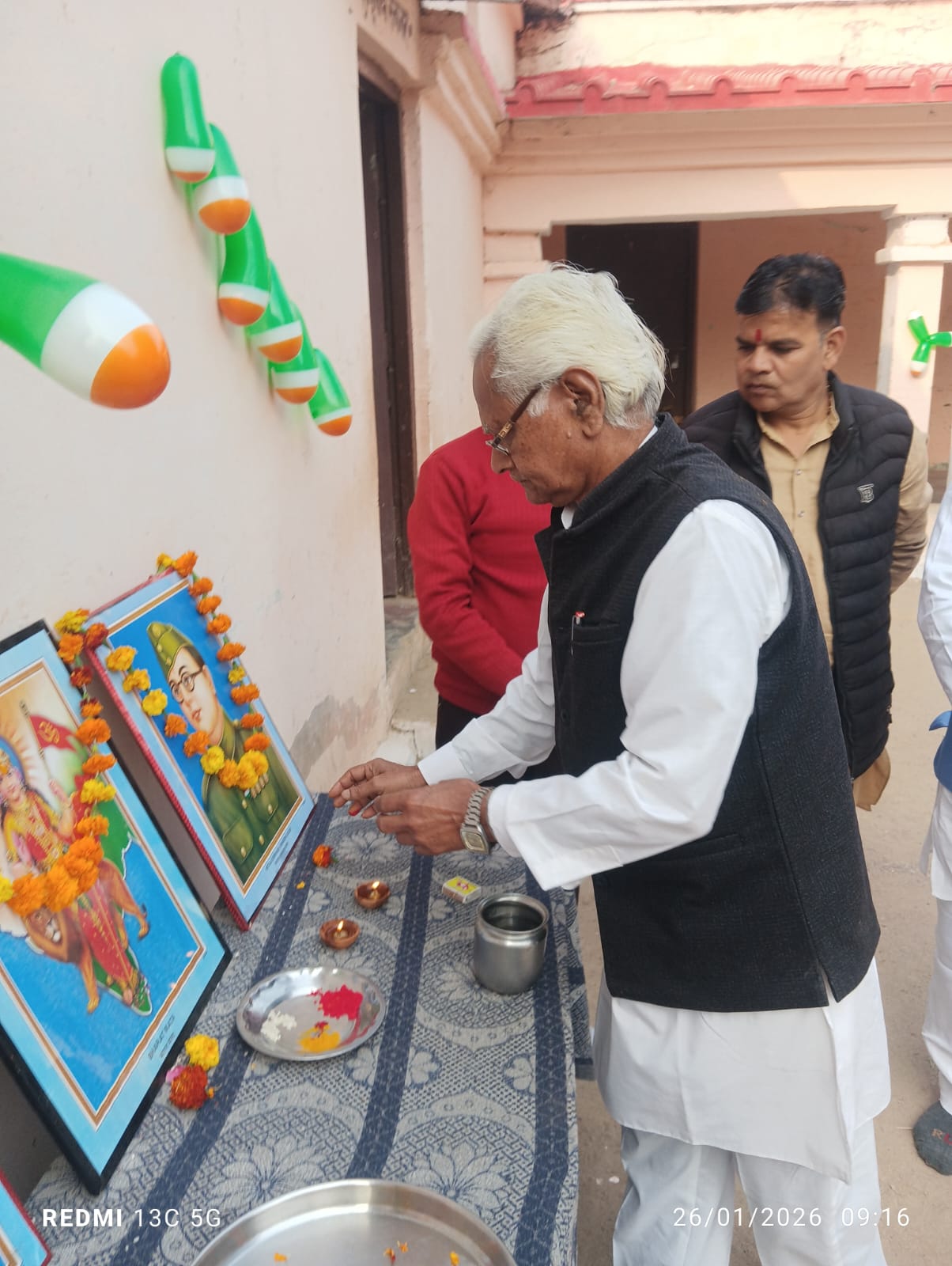Republic Day ceremony - lighting the lamp before the Bharat Mata and Netaji portraits